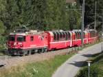 Ge 4/4 II 623 am 21.07.10. mit dm BEX nach Tirano am Haken kurz nach dem Bahnhof von Bergn.